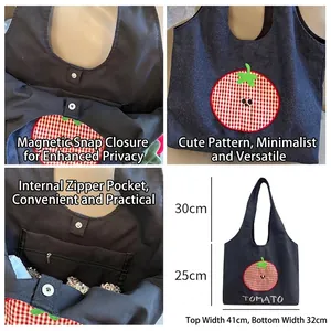Retro denim tote bag with embroidered tomato design and metal buckle closure