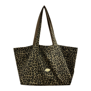 Leopard print canvas tote bag with wide shoulder straps and large capacity for daily use