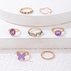 7-piece gold alloy ring set with purple butterfly drip oil and sparkling gemstones
