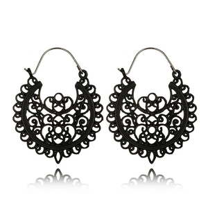 Detail showing the black mandala镂空pattern and bohemian geometry on these round earrings