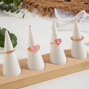 Detail of pink butterfly and heart ring set with diamond accents on white display