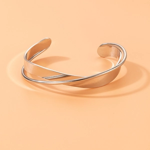 Minimalist silver crossover open bangle with geometric irregular punk style design