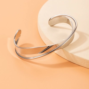Minimalist silver crossover open bangle with polished double layer twisted metal design