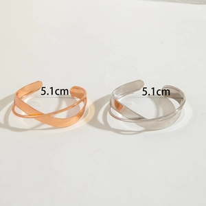 Detail showing cross design bracelets in rose gold and silver with 5.1cm inner diameter