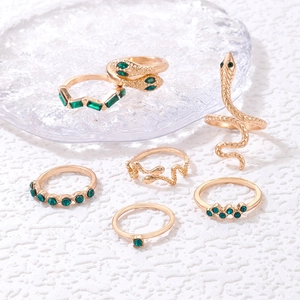 Retro gold snake ring set with green gemstones and geometric crystal accents for women