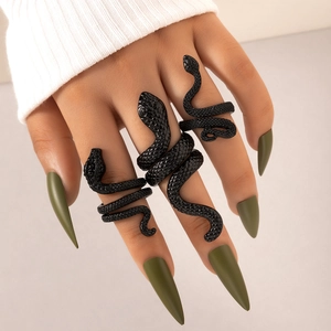 Three-piece set of black snake-shaped rings with textured scales and adjustable open design