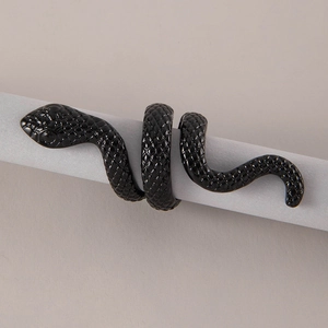Macro detail of the black snake ring showing intricate scale textures and Gothic design