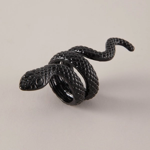 Close-up of matte black snake ring showcasing intricate 3D scale texture and punk design