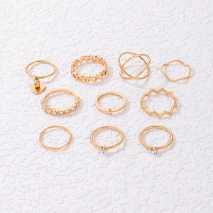 10-piece gold ring set with heart pendant, stars, and sparkling rhinestone details