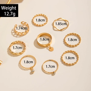 Detailed view of 9-piece gold ring set with weight 12.7g and precise size dimensions