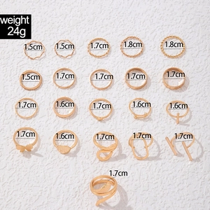 Detailed view of 21-piece gold butterfly and heart ring set with size specifications