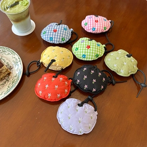 Set of eight floral embroidered fabric protective cases for earphones with lanyards