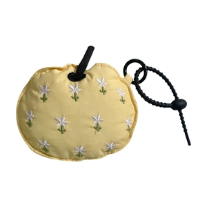 Sweet yellow apple-shaped earphone case with white flower embroidery and black lanyard