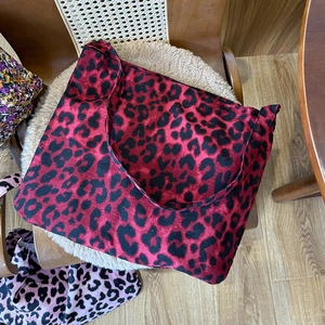 Chic leopard print canvas tote bag with red and black pattern in a spacious design