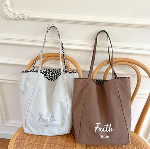 Minimalist canvas tote bag with leopard print lining in light grey and mocha brown colors