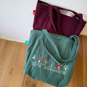 Autumn corduroy tote bags with mushroom embroidery and reinforced handles in retro style