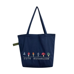 Retro corduroy tote bag in navy blue with cute colorful mushroom embroidery detail