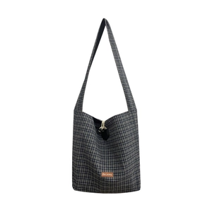 Vintage black and white plaid canvas tote bag with toggle closure and leather patch