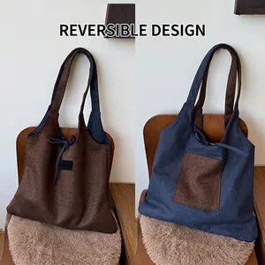 Detail of reversible leopard print tote bag showing blue canvas side and drawstring tie
