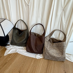 Three leopard print hobo tote bags in green, brown, and beige with large capacity design