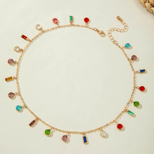 Detail of colorful gemstone necklace with gold chain, lobster clasp and extender