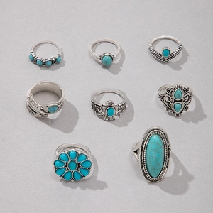 Detailed view of bohemian turquoise ring set with sunflower and eagle silver engravings