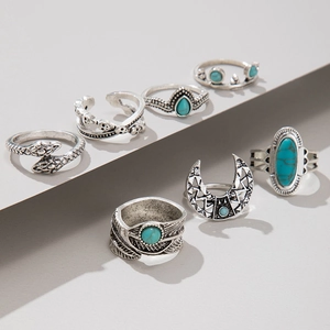 Detail view of 7pcs vintage silver bohemian rings set with turquoise and moon accents