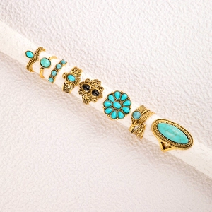 Detail view of 8pcs vintage bohemian rings set with turquoise and antique gold finish