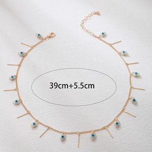 Detail view of gold evil eye necklace with vertical bars, length 39cm plus 5.5cm chain