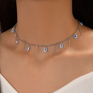 Detailed close-up of evil eye choker with blue round charms and silver bars on neck