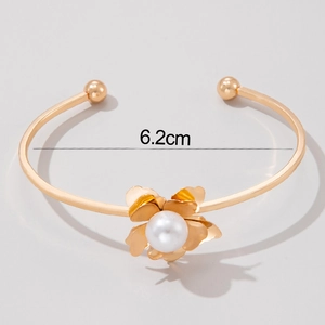 Detailed view of floral bangle with 6.2cm inner diameter and pearl center accent