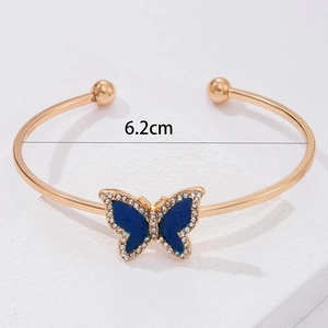 Detail of flower pearl cuff bracelet with blue butterfly and 6.2cm inner diameter