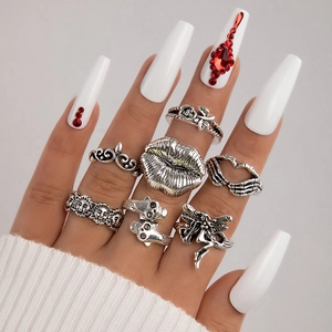 7-piece gothic punk ring set with butterfly skull and sun motifs in vintage silver finish
