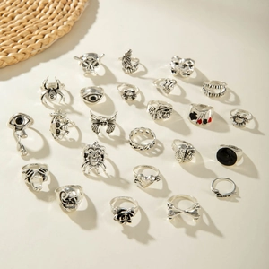 Detailed view of 24pcs gothic punk rings set with skull butterfly and rose patterns