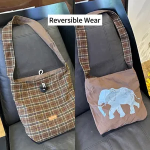 Reversible tote bag featuring brown plaid pattern and a cute blue elephant design