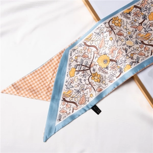 Floral print silk scarf with yellow flower patterns and orange checkered design