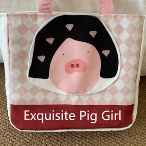 Detail of canvas lunch bag featuring pink argyle pattern and Exquisite Pig Girl cartoon