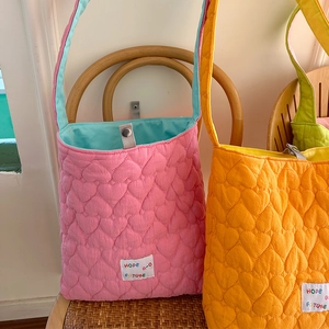 Quilted heart pattern tote bag with Hope Future patch and vibrant contrast colors