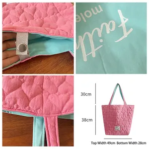Pink heart quilted tote bag with reversible mint green lining and strap dimensions