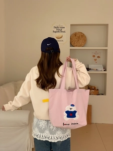 Pink canvas tote bag featuring cute bear embroidery and large capacity for daily use