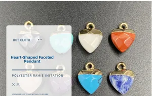 Detailed macro view of faceted heart pendants in multiple colors with gold loops