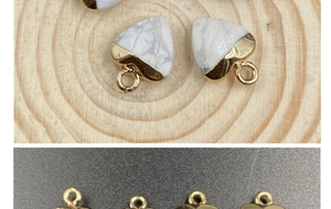 Detail of heart-shaped white marble pendant with gold-plated base for DIY necklace