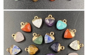 Detailed view of assorted heart-shaped gemstone pendants with faceted finish and gold loops