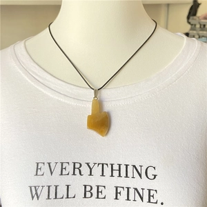 Creative yellow agate stone hand gesture pendant with black cord necklace on model