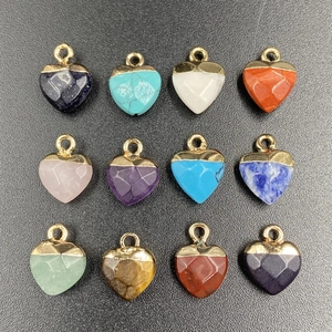Set of faceted heart-shaped gemstone pendants with gold plated edges in various colors