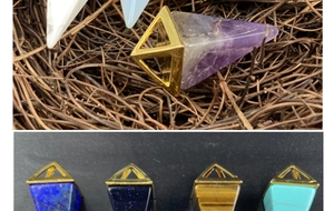 Macro detail of geometric pyramid pendants in amethyst, tiger eye, and lapis lazuli
