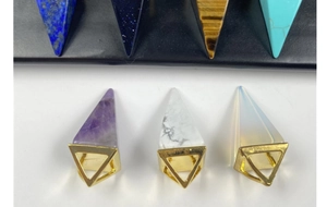 Detailed collection of hexagonal crystal pendants with golden metal clasps