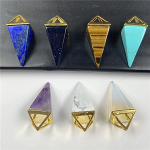 Set of seven natural crystal cone pendants including amethyst and lapis with gold clasps