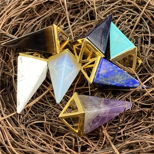 Pyramid crystal pendants set in tiger eye and amethyst with geometric gold frames