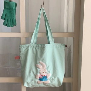 Mint green canvas drawstring tote bag with cute 3D plush rabbit embroidery and handle